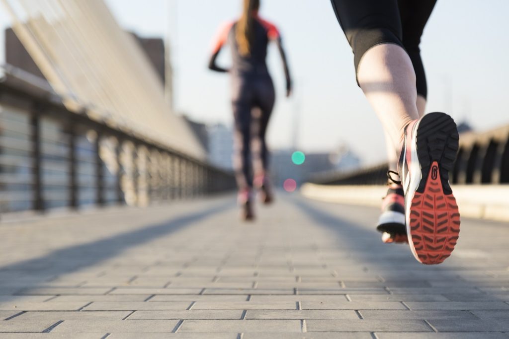 two women running in the street