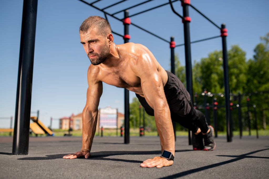 man perfoming calisthenics exercise